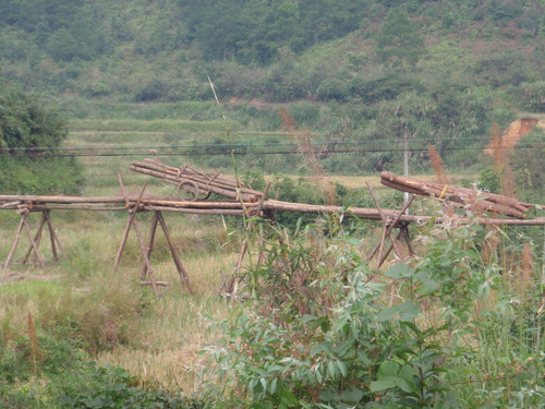 Building a wood bridge for a fixed width cart wheels.
